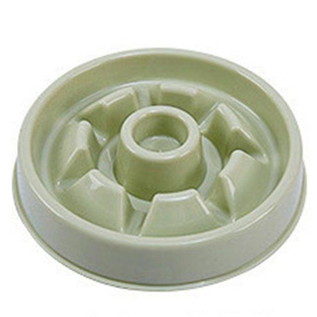 Light green plastic component on a white background