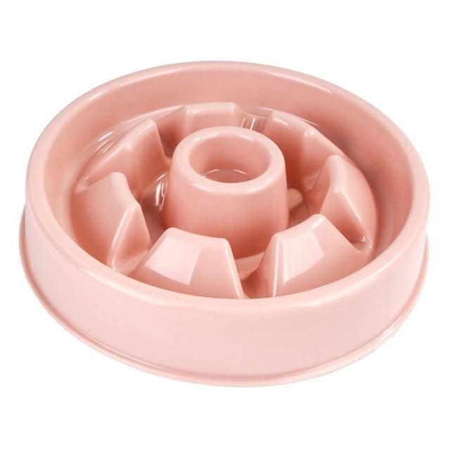 Pink slow feeder bowl for pets on a white background