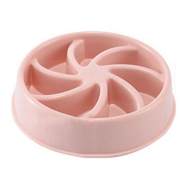 Pink slow feeder bowl for pets on a white background