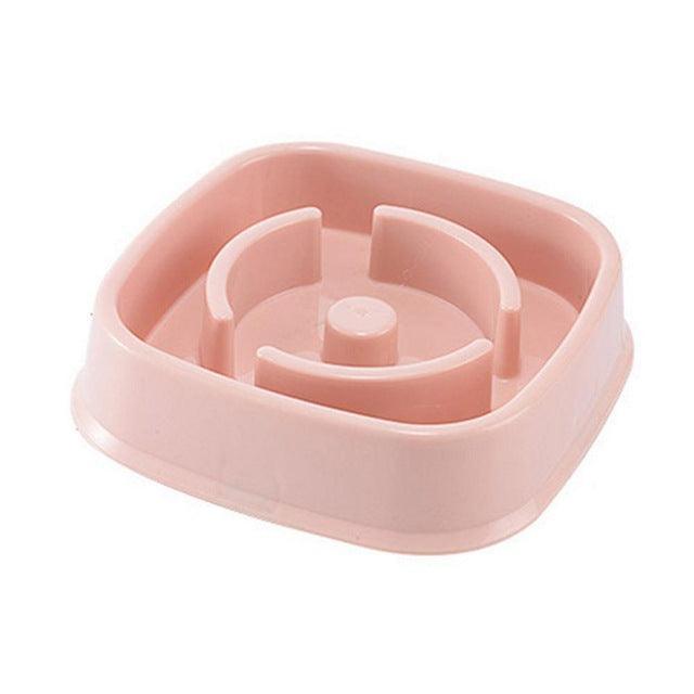 Pink slow feeder bowl for pets on a white background