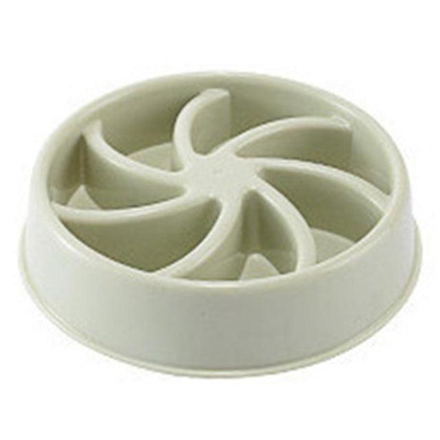White plastic component with a central circular design on a white background