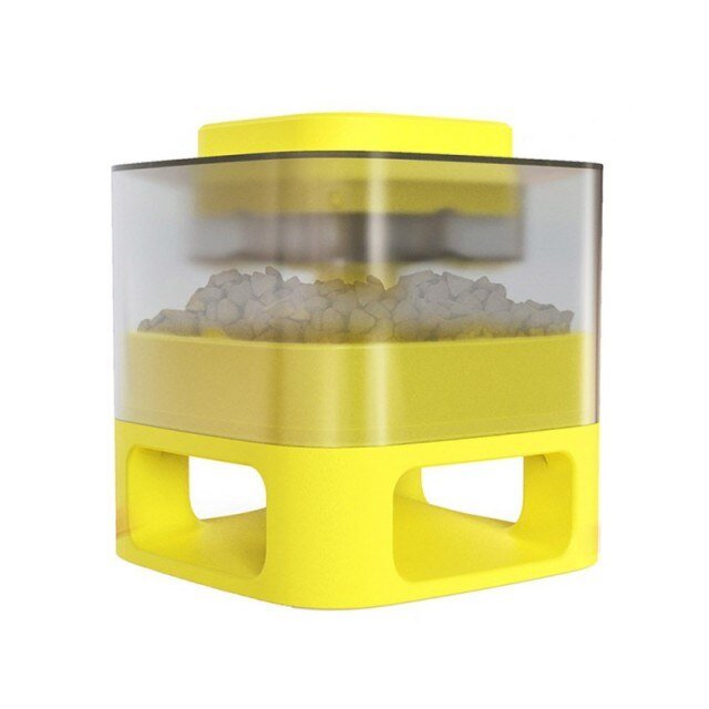 Yellow pet toy with transparent top on a white background